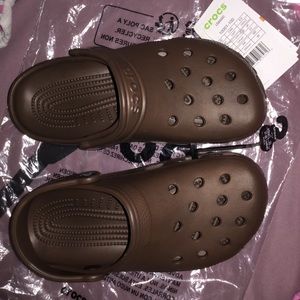 Dark brown crocs with jibbitz